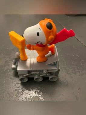 Peanuts Snoopy Orange Astronaut Figure with Red Cape on Gray Rover nasa